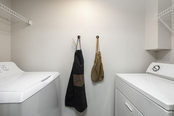 A laundry room with a washer and dryer.